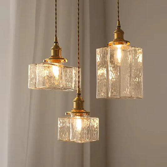 Three textured glass pendant shade styles with brass-finish fittings