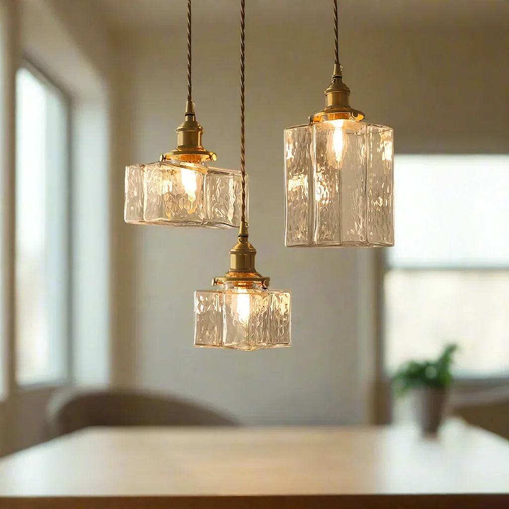 Three textured glass pendant styles over a counter