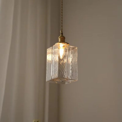 Tall textured glass pendant with a twisted cord
