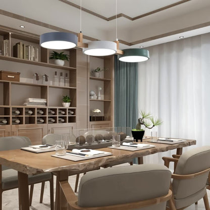 Three-disc pendant above a dining table