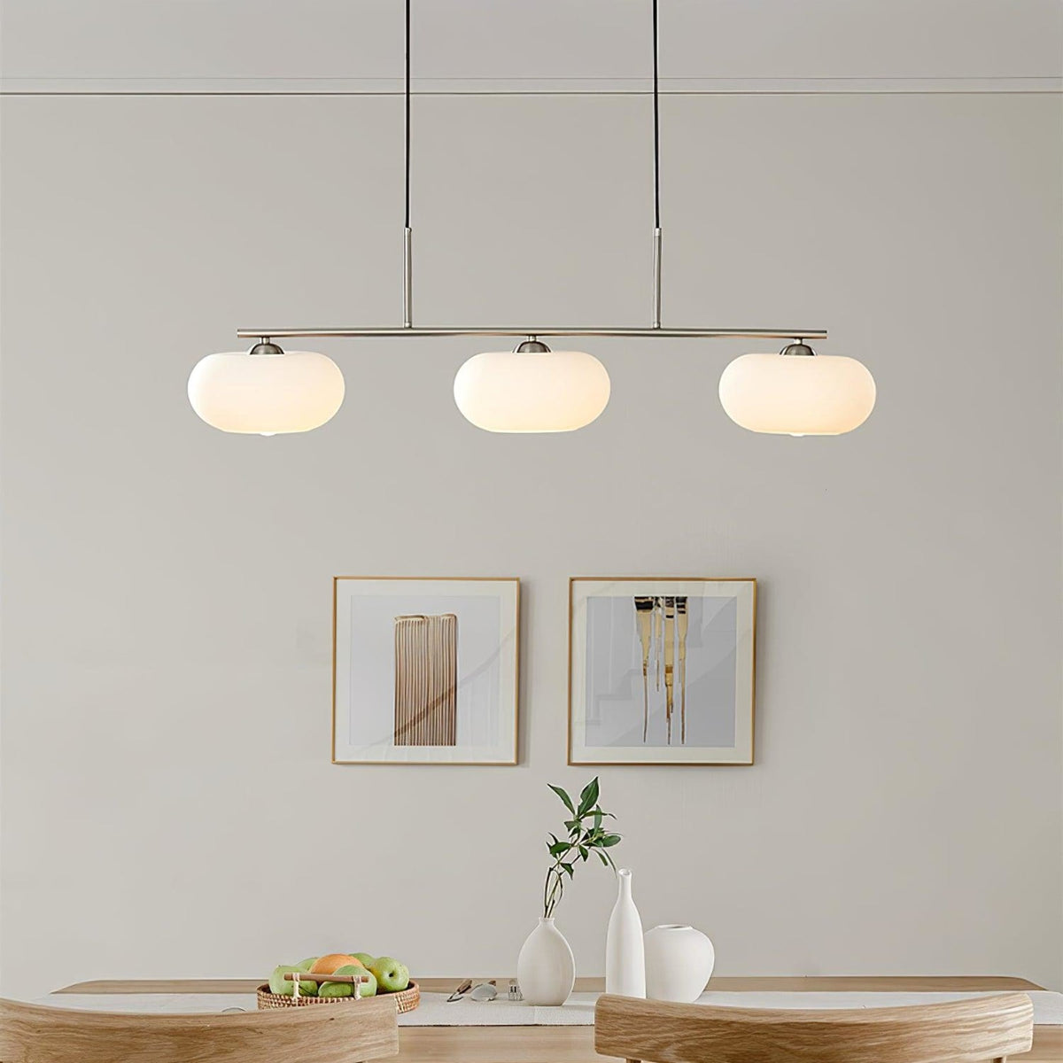 Three-light linear glass pendant in a dining room