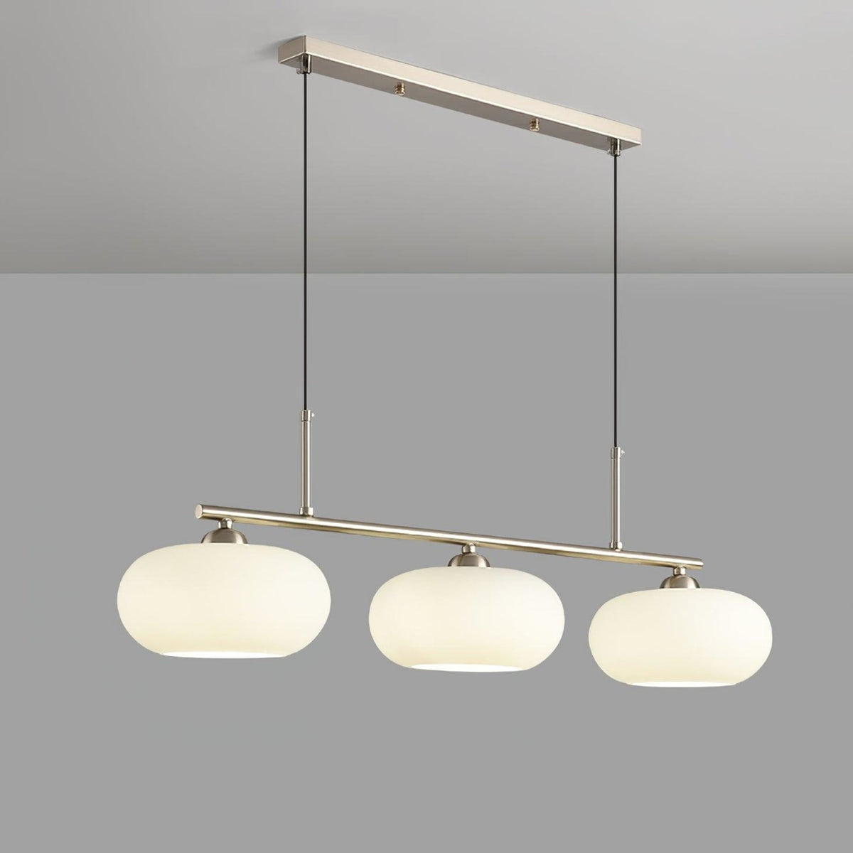 Three-light linear pendant with white glass shades