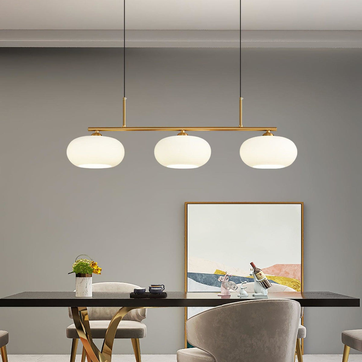 Three-light linear glass pendant in a dining room