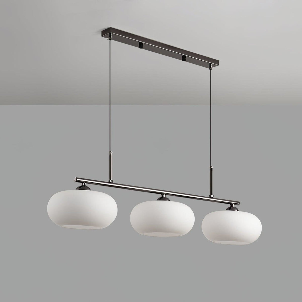 Three-light linear pendant with white glass shades