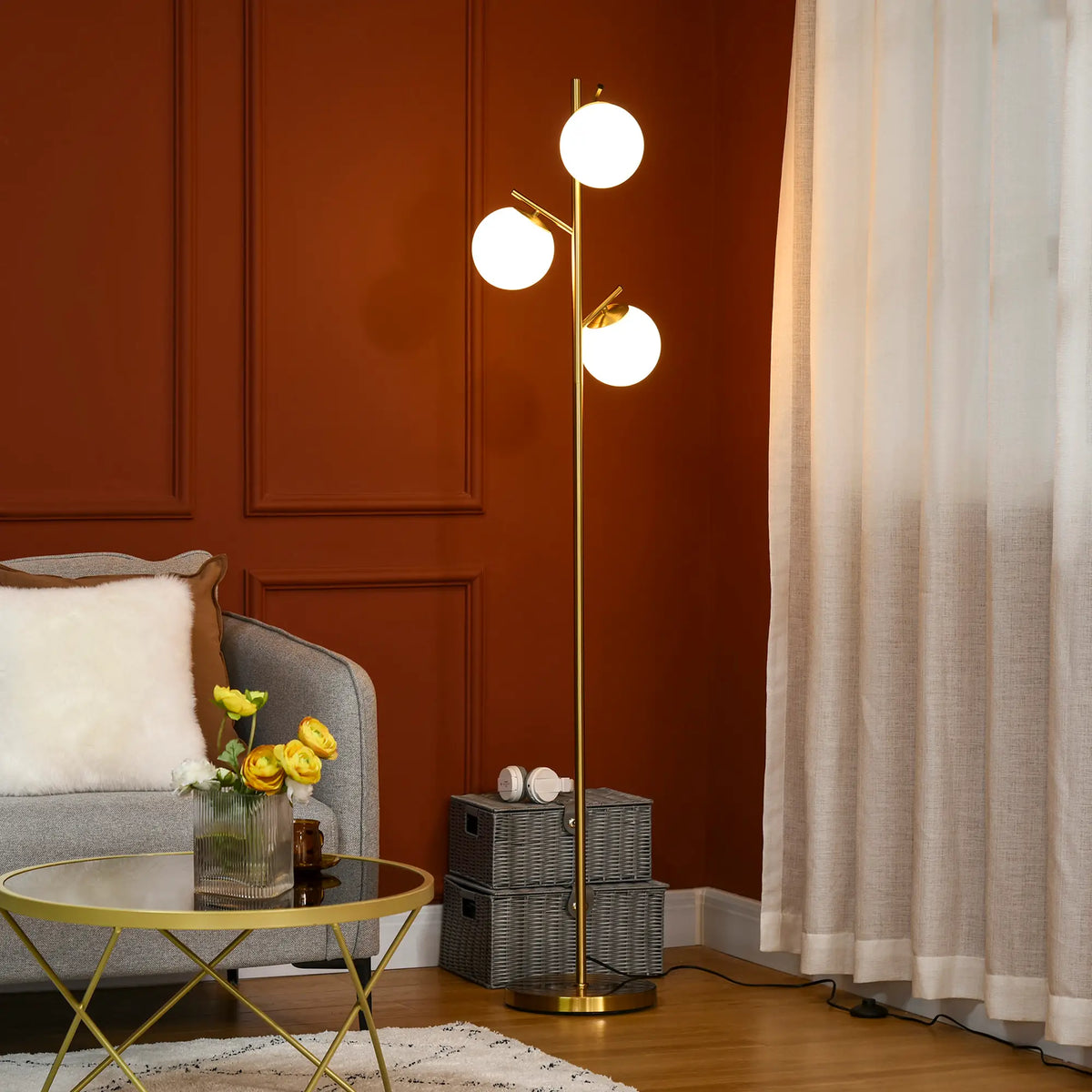 Gold tone three-light tree floor lamp with glass globe shades