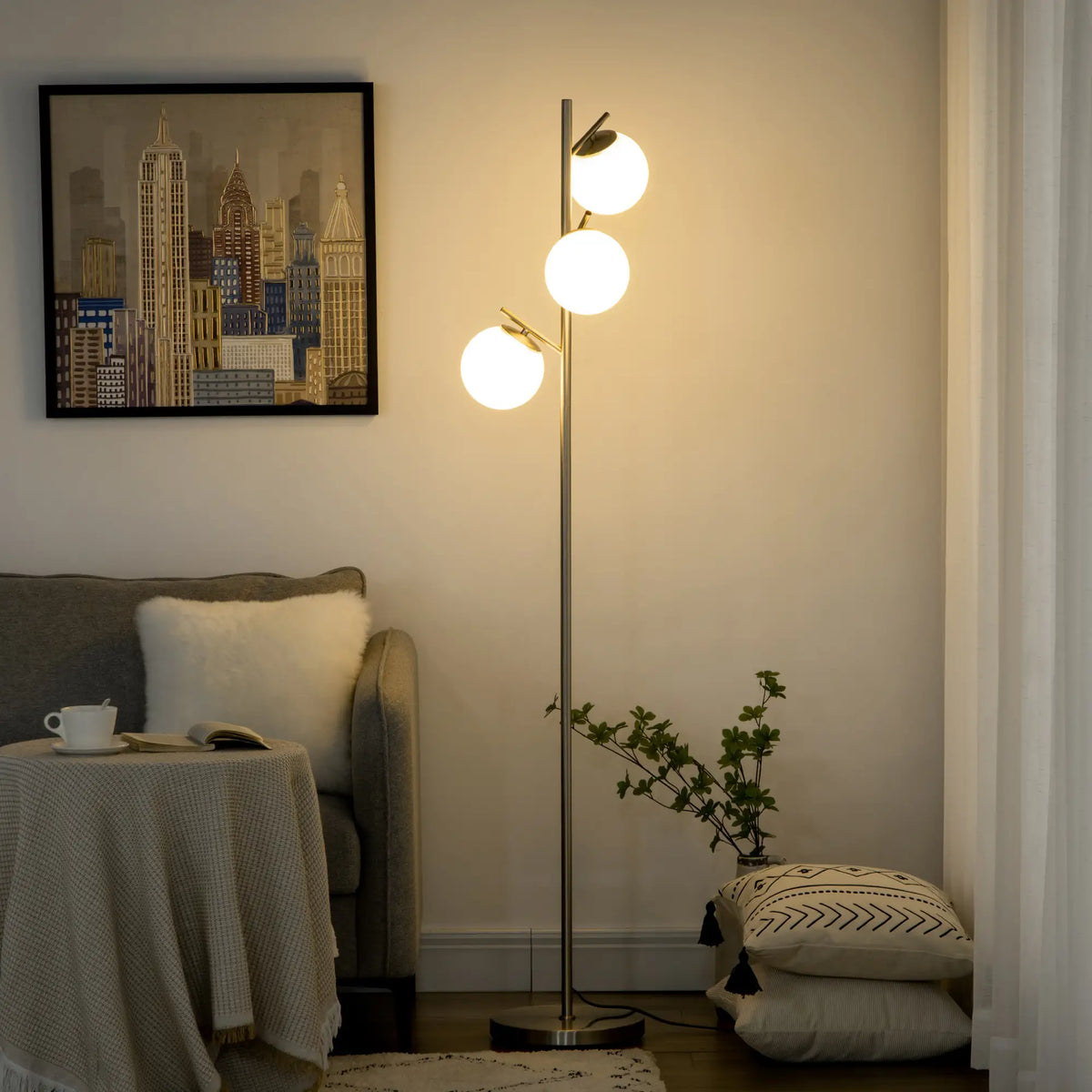 Silver tone three-light tree floor lamp with glass globe shades