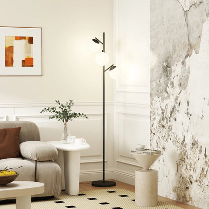 Black three-light tree floor lamp with glass globe shades