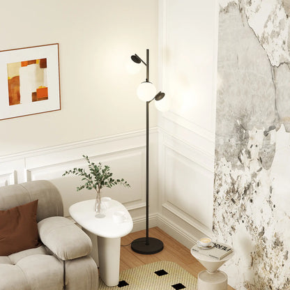 Black three-light tree floor lamp with glass globe shades