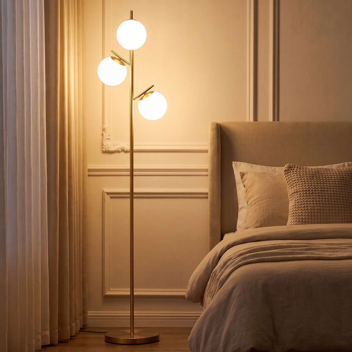 Gold tone three-light tree floor lamp with glass globe shades