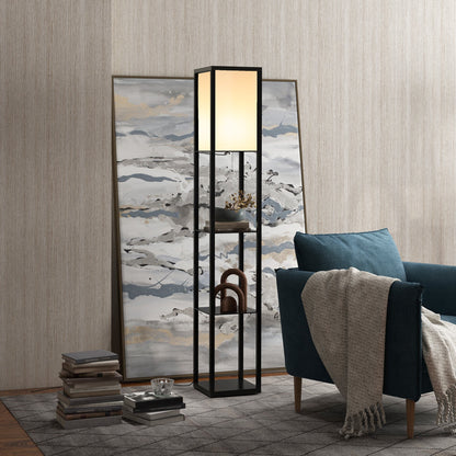 Black shelf floor lamp with white shade beside an armchair