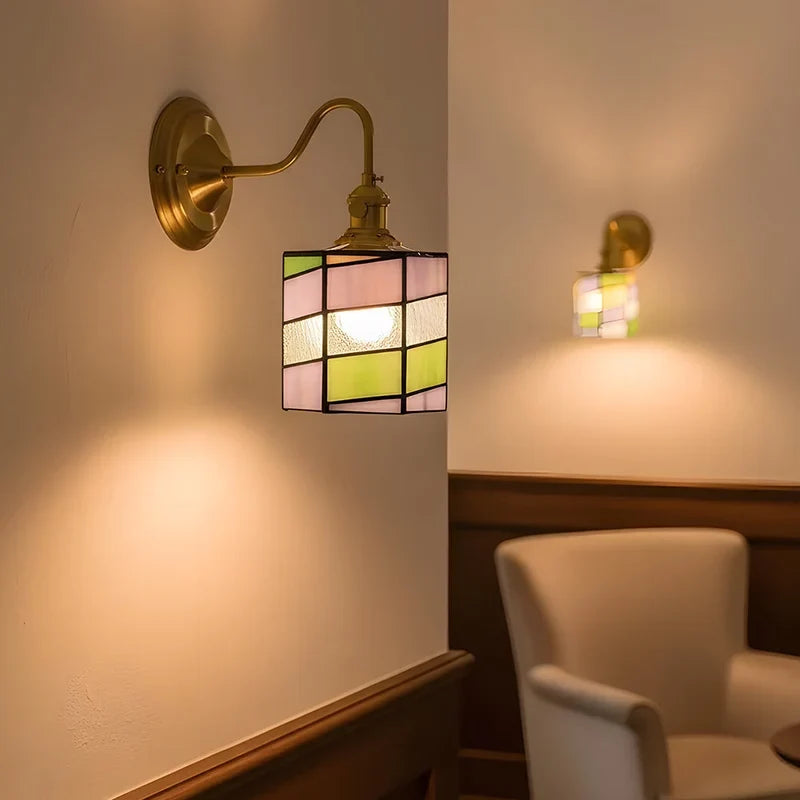 Geometric glass wall sconce in a hallway