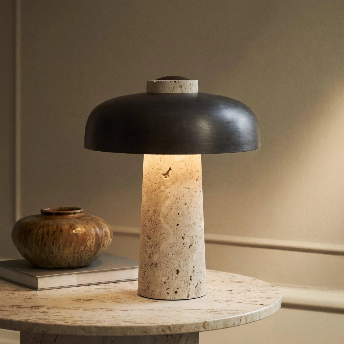 Travertine table lamp with black dome shade