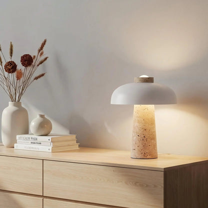 White dome travertine lamp on a console