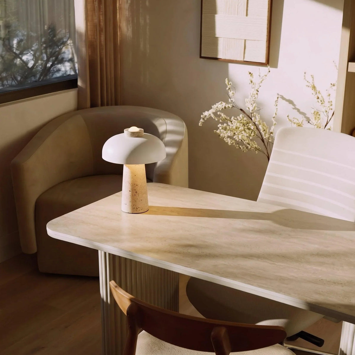 White dome travertine lamp on a table