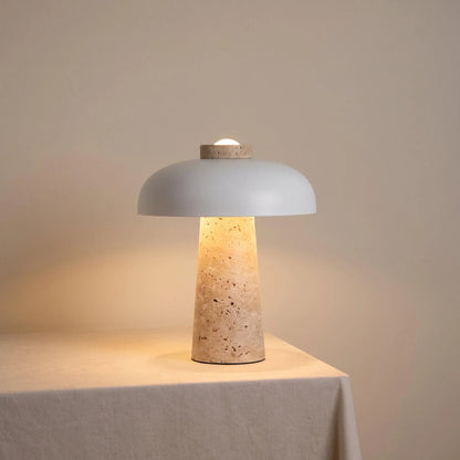 White dome travertine lamp casting warm light