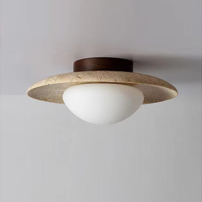 Travertine saucer ceiling light mounted on a ceiling