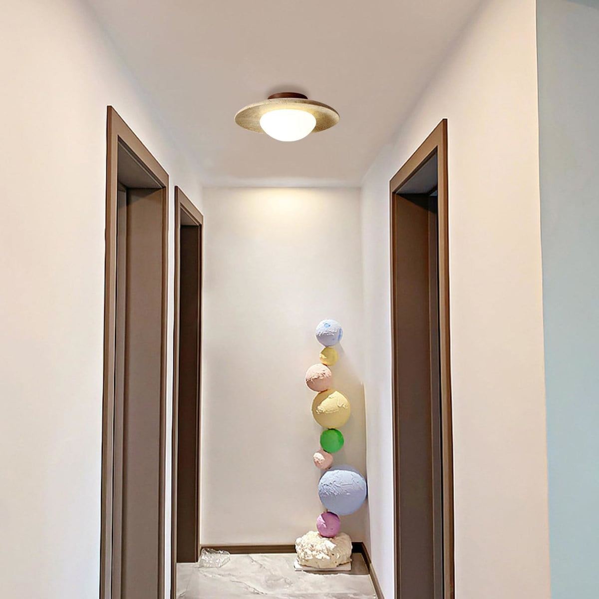 Travertine ceiling light above an entryway