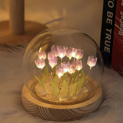 Purple tulip night light beneath a glass dome