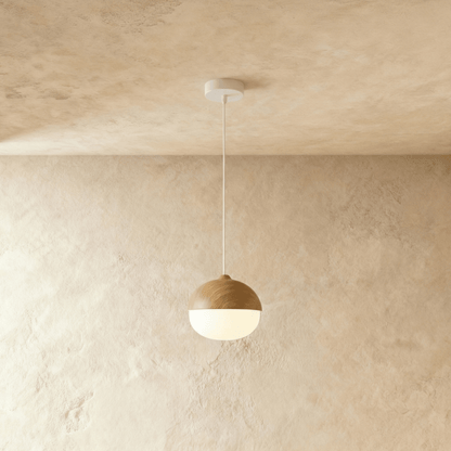 Two-tone globe pendant with wood-tone upper shade and white glass diffuser