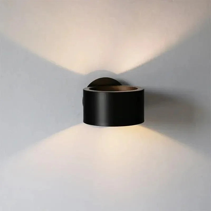 Matt black drum wall light with soft beams