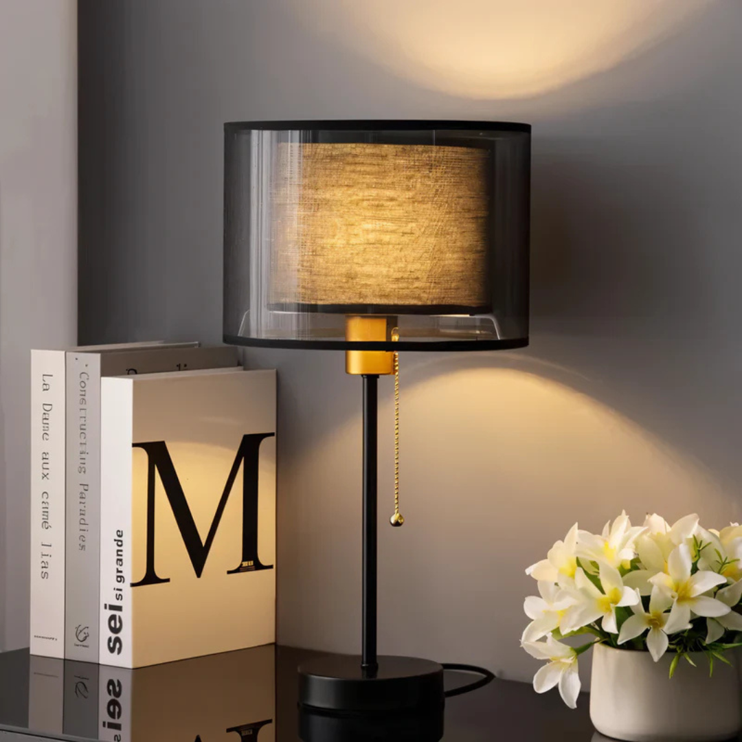 Close-up of a black vintage table lamp with a double dark fabric shade