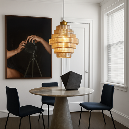 Amber tiered glass pendant above a round dining table