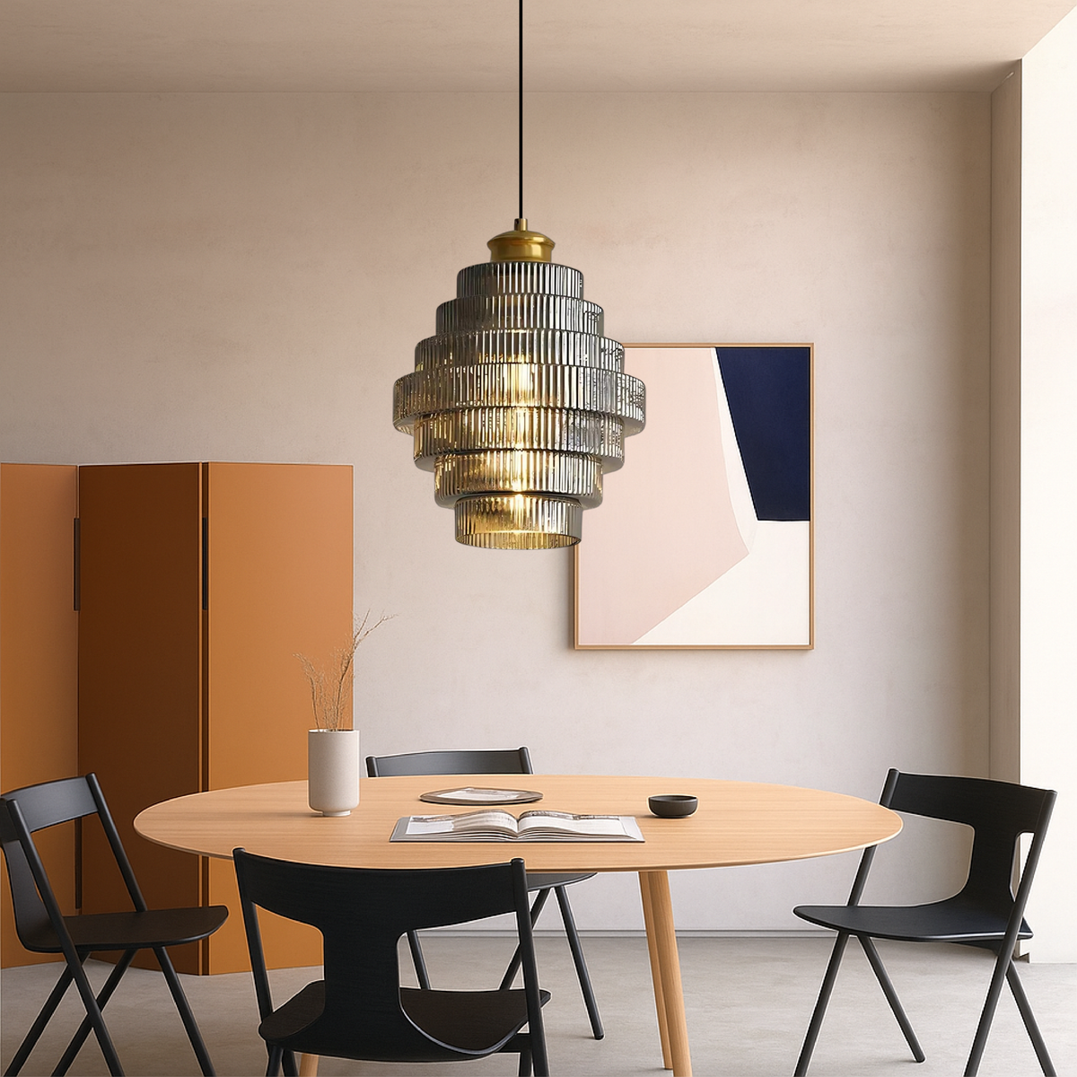 Smoky grey tiered glass pendant above a table