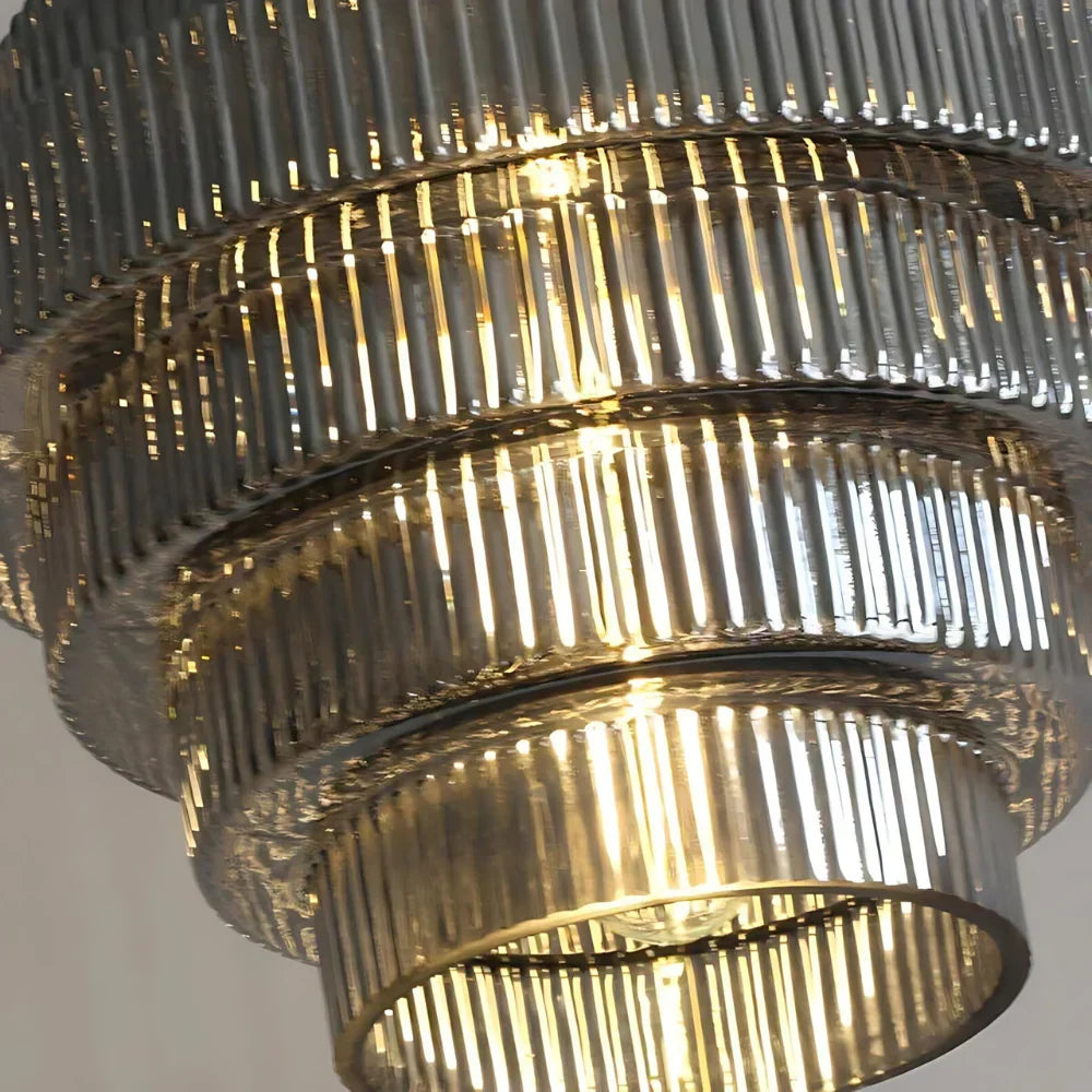 Close view of ribbed glass tiers and bulb
