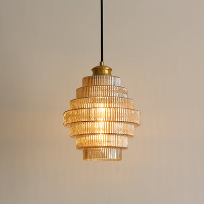 Amber ribbed tiered pendant with warm light