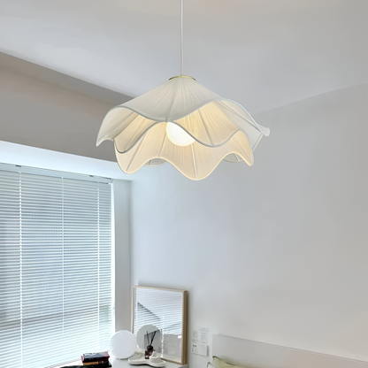 Illuminated fabric pendant near a window