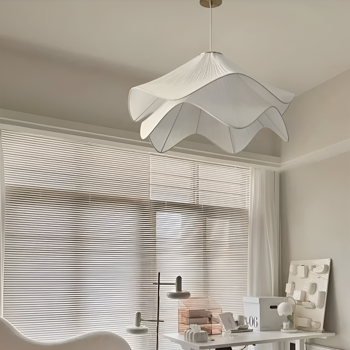White wavy fabric pendant near window blinds