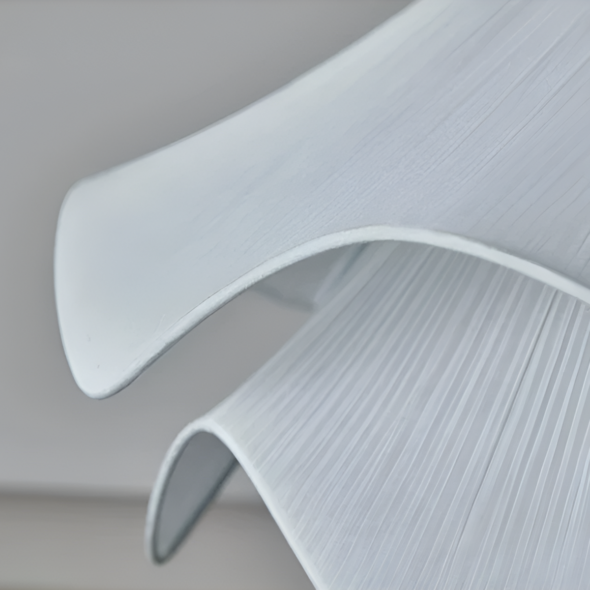 Close-up of curved fabric edges and shade texture