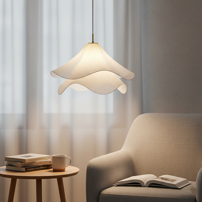 Illuminated white fabric pendant beside an armchair
