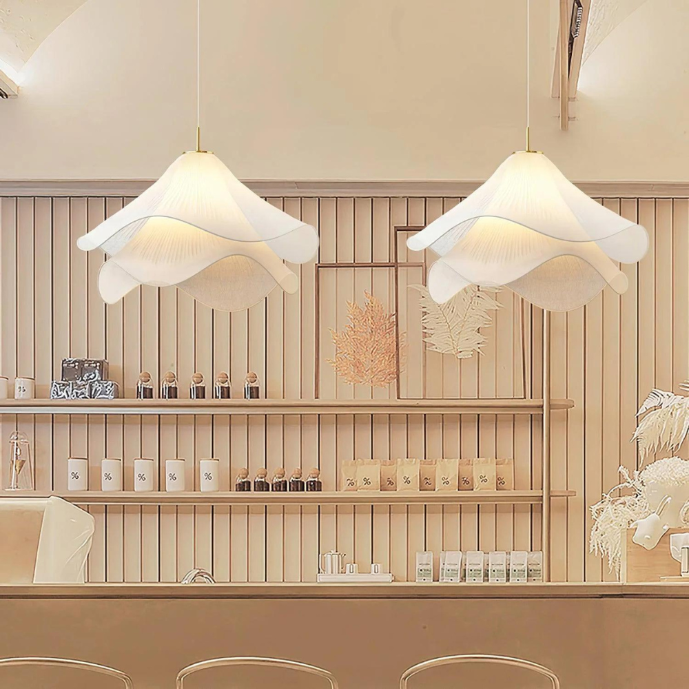 Two wavy fabric pendants above a bar counter