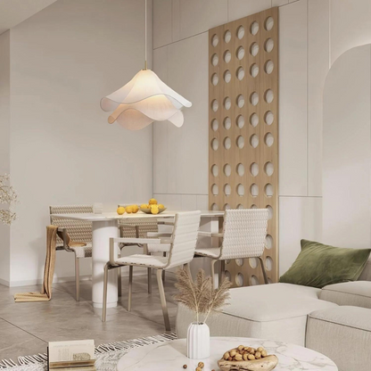 White wavy pendant in a combined dining and living space