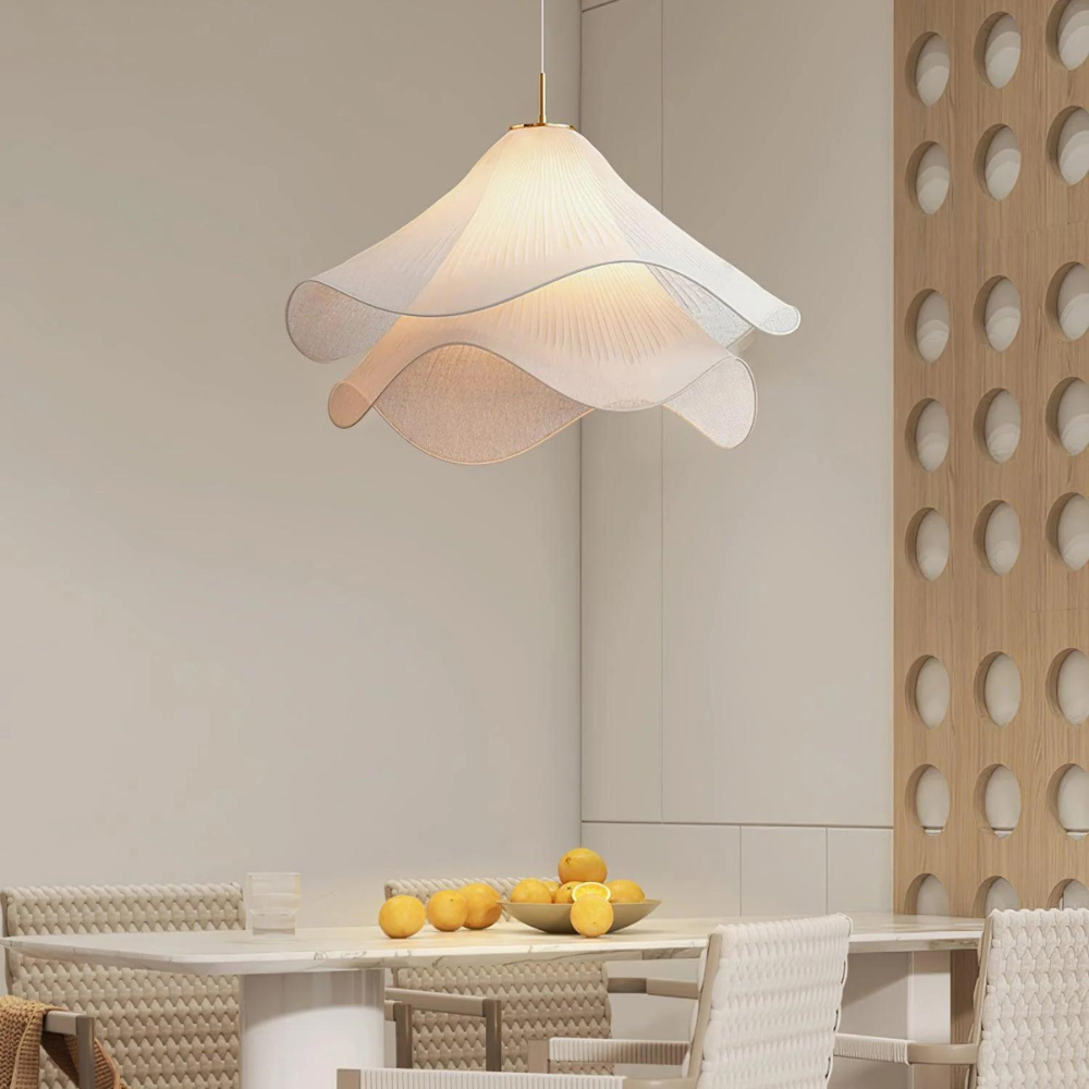 Close-up of wavy fabric pendant above a table