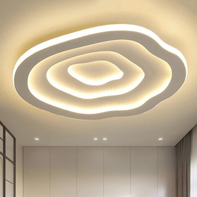 Layered wavy ceiling light illuminated in warm light