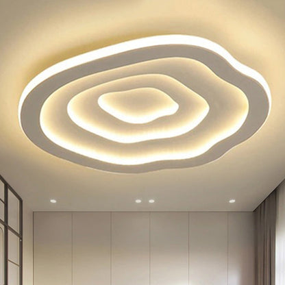 Layered wavy ceiling light illuminated in warm light