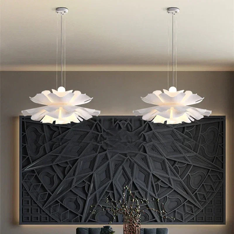 Two lotus flower pendant lights above a dining table