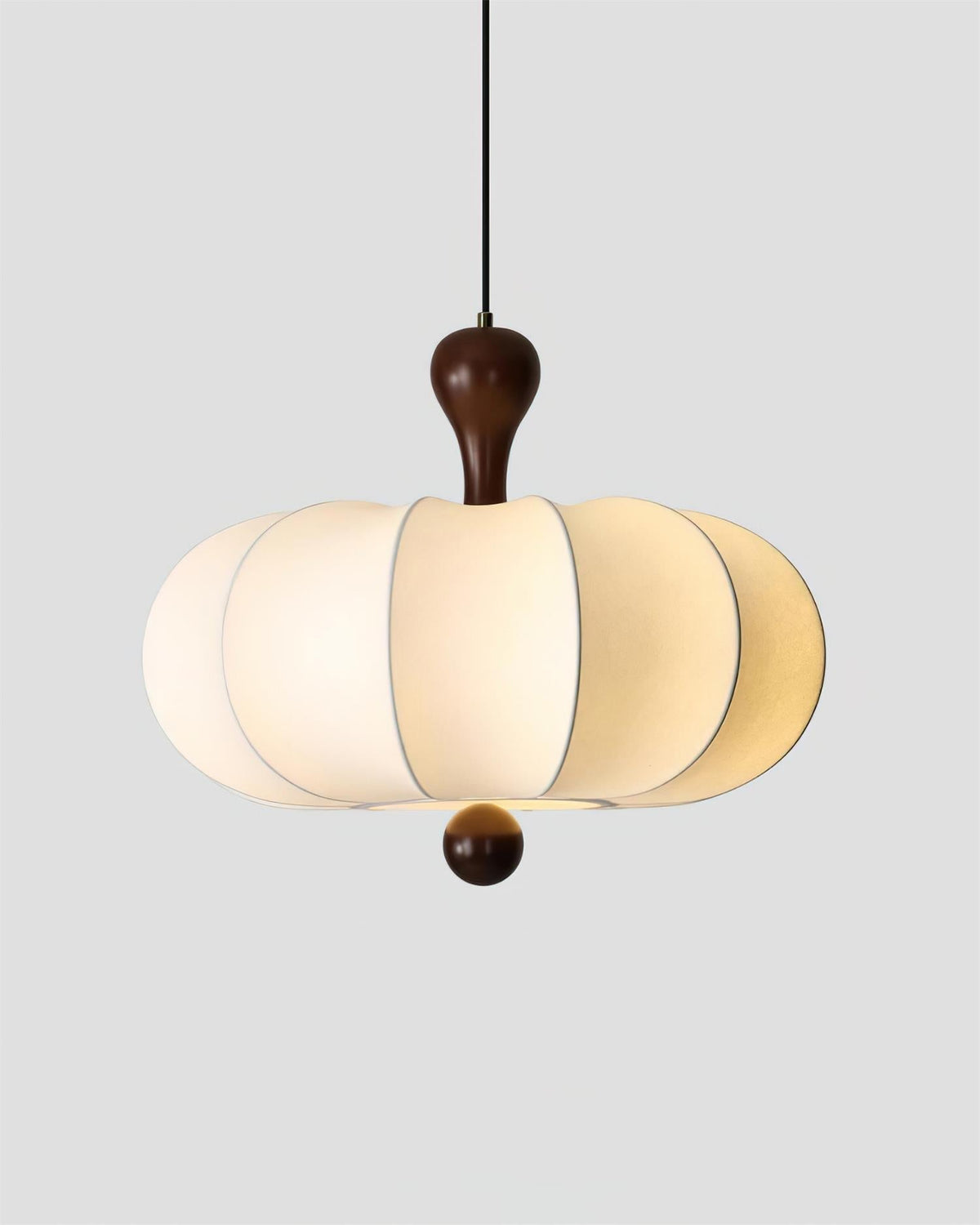White sculptural pendant with rounded panels and walnut-tone detail