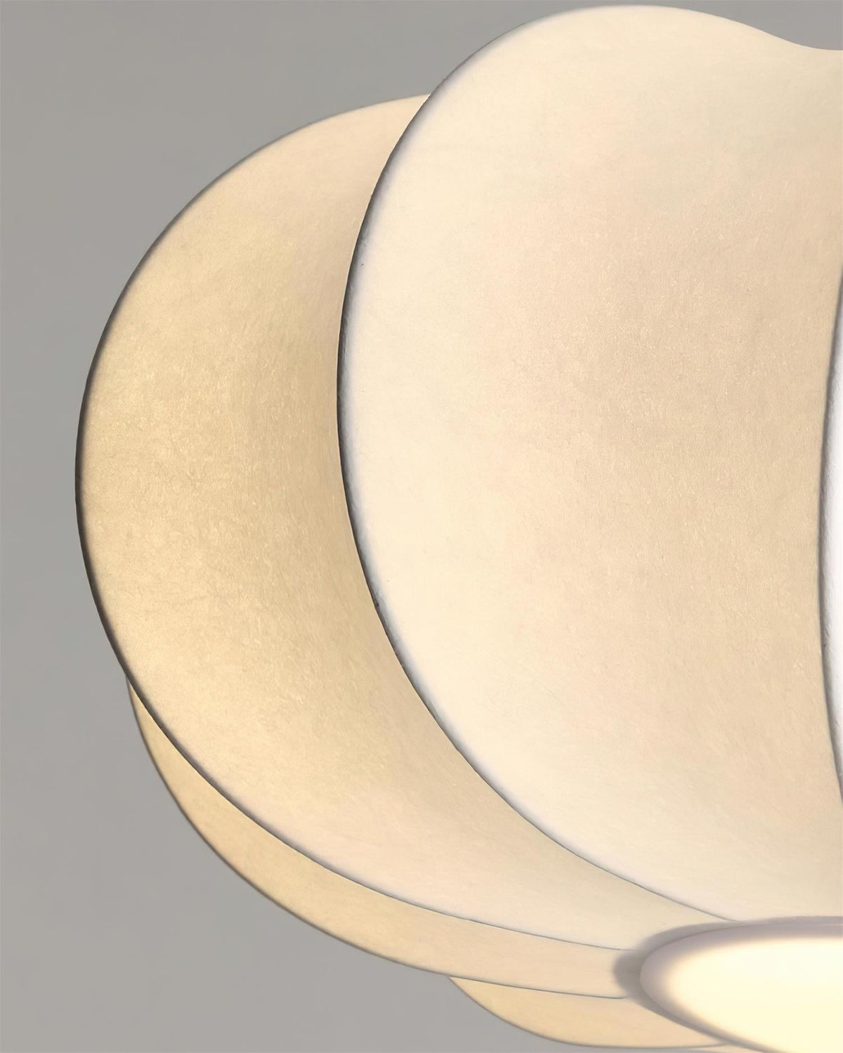 Close view of white sculptural shade surface