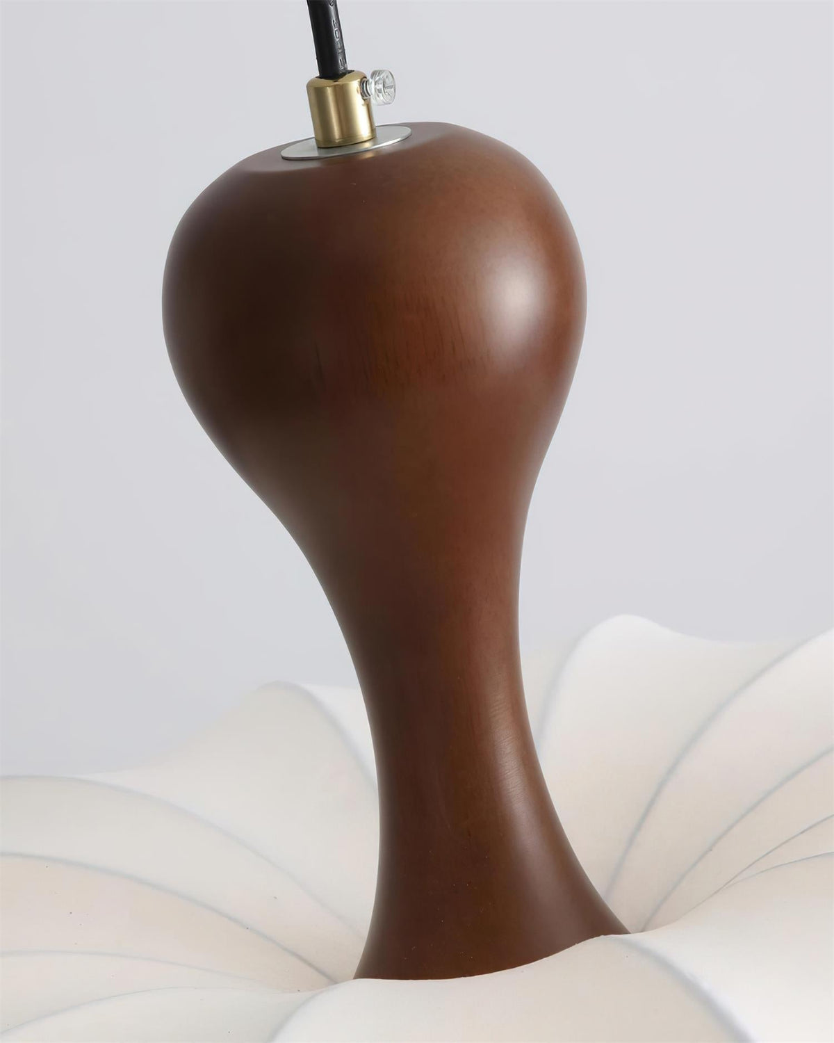Close view of walnut-tone pendant top
