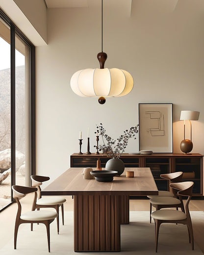 White sculptural pendant in a dining room