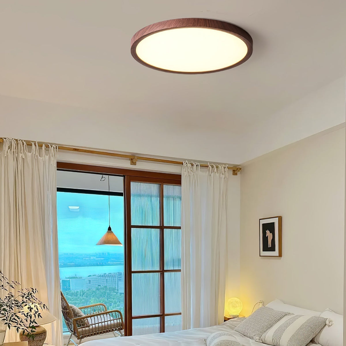 Wood-effect flush ceiling light in a bedroom overlooking the sea