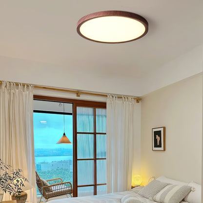 Wood-effect flush ceiling light in a bedroom overlooking the sea