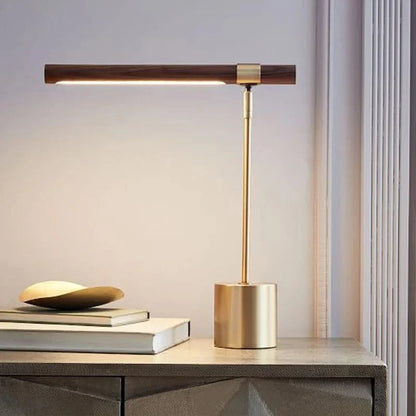 Wood light-bar table lamp beside books
