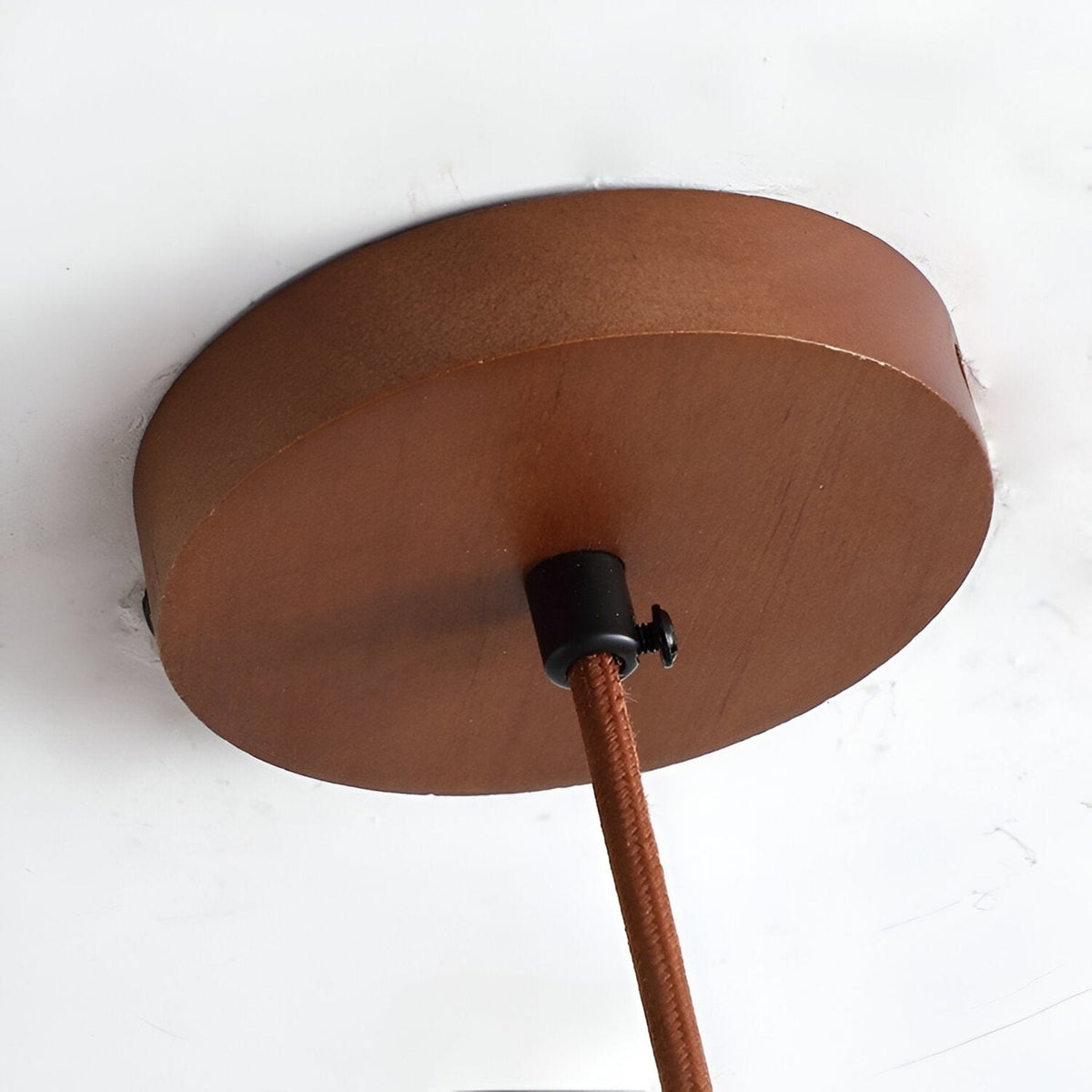 Close view of wood ceiling canopy and cord